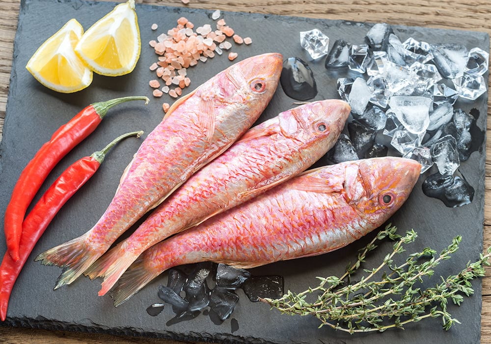 Raw red mullet with ingredients