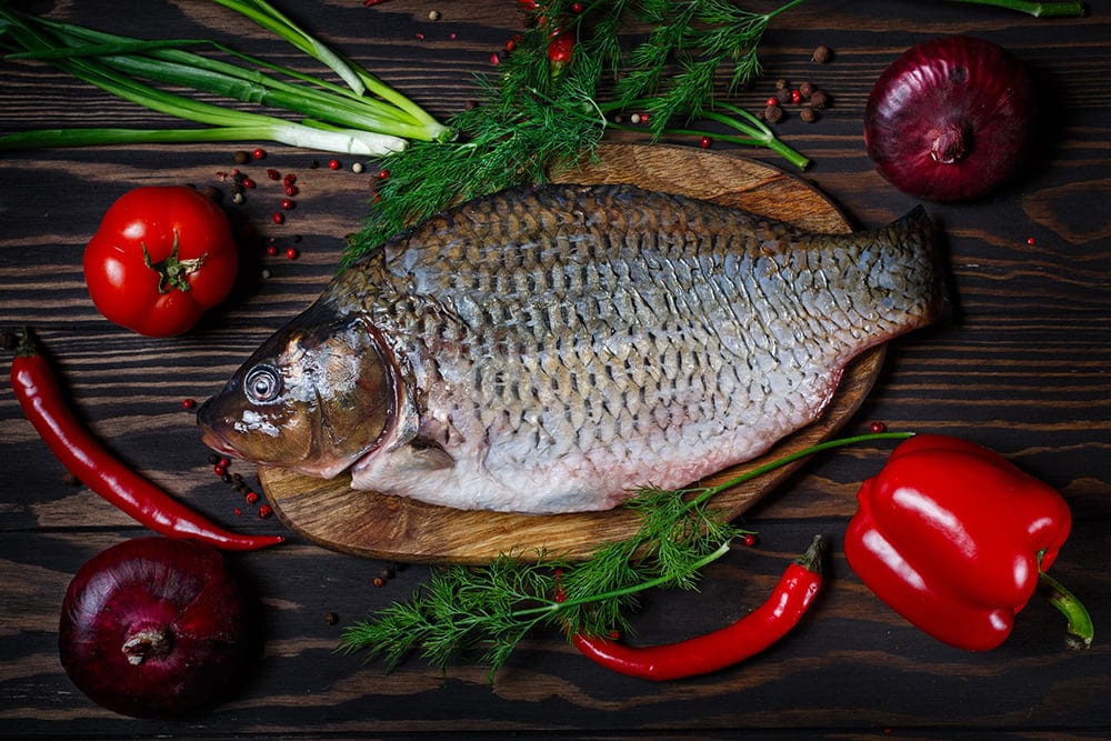 Carp fish with fresh vegetables