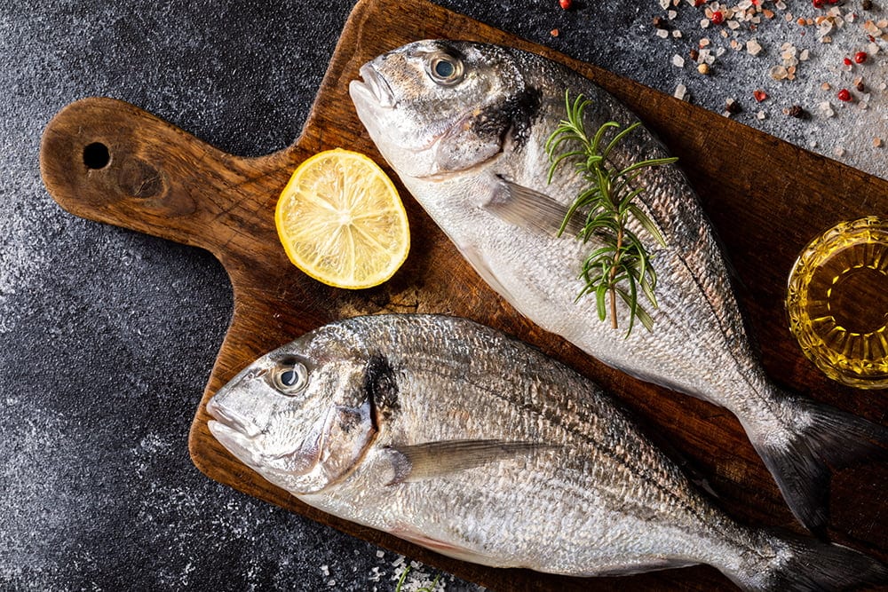 Fresh uncooked Dorado or sea bream fish