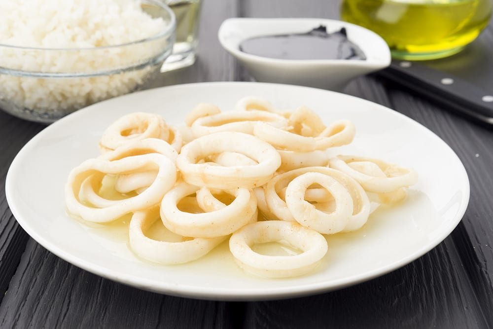 dish of fried squid rings on wood