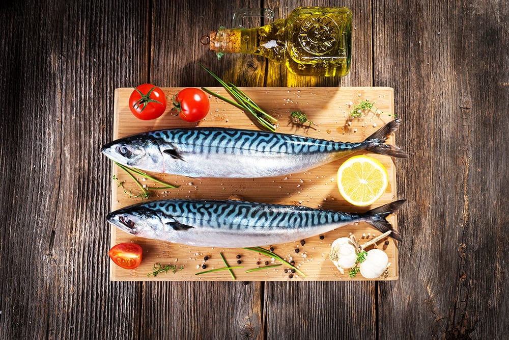 Fresh mackerel on wooden background