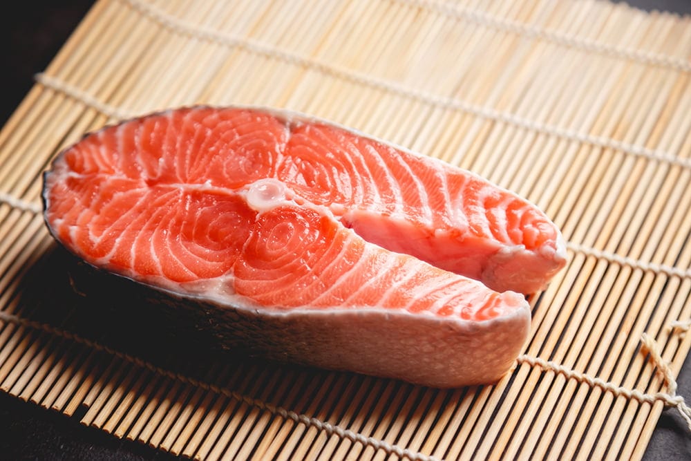 Piece of a salmon on bamboo napkin
