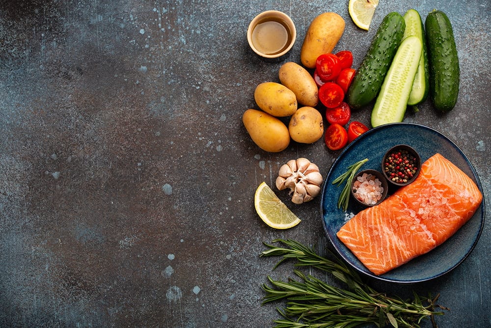Raw salmon fillet and vegetables